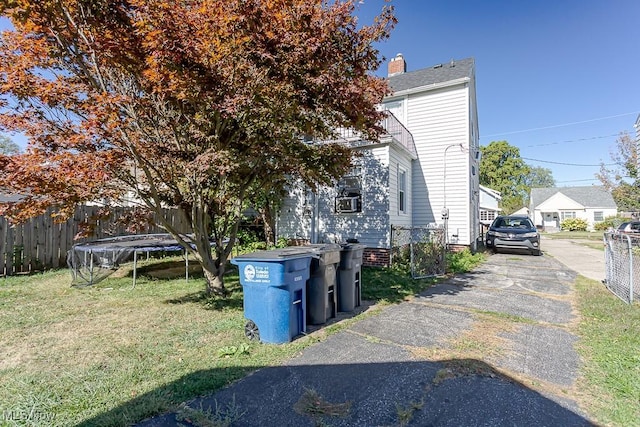 1387 Glenview Rd, Toledo, OH 43614 - view of front of home with a trampoline and a chimney