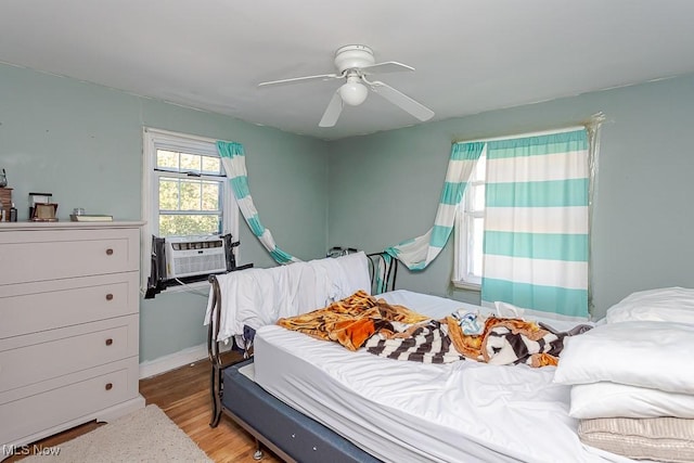 1387 Glenview Rd, Toledo, OH 43614 - bedroom with cooling unit, wood finished floors, and ceiling fan