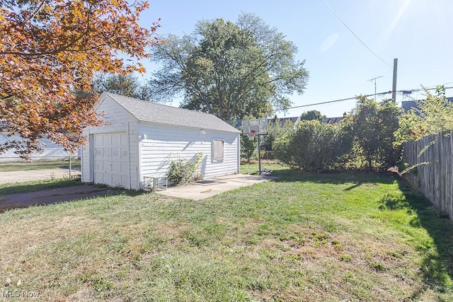 1387 Glenview Rd, Toledo, OH 43614 - fenced backyard featuring a garage, an outdoor structure, and driveway