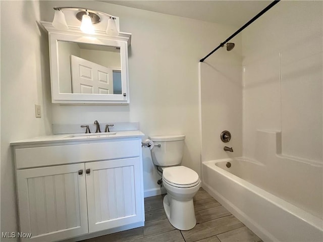 507B Memory Ln, Bethesda, OH 43719 - bathroom featuring vanity, tub / shower combination, and wood finished floors