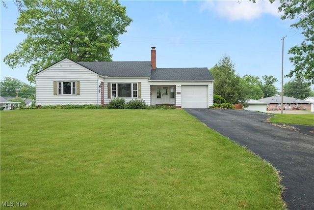 1005 Fairview Blvd, Coshocton, OH 43812 - single story home featuring a garage, driveway, a chimney, a front yard, and roof with shingles