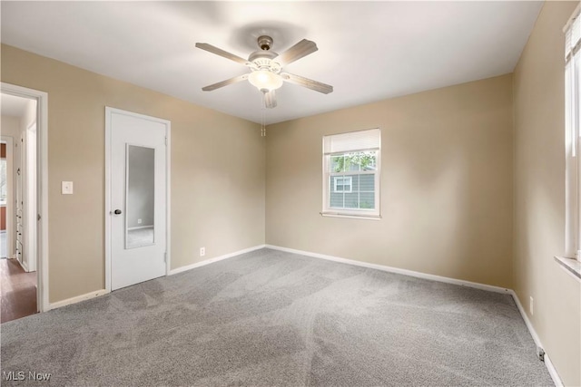 1005 Fairview Blvd, Coshocton, OH 43812 - unfurnished bedroom featuring carpet flooring and a ceiling fan