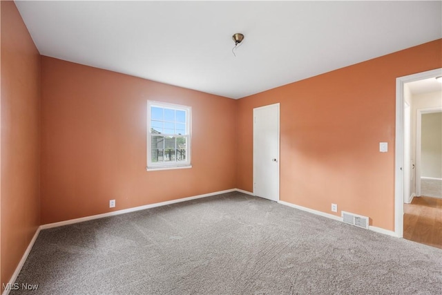 1005 Fairview Blvd, Coshocton, OH 43812 - carpeted spare room featuring baseboards