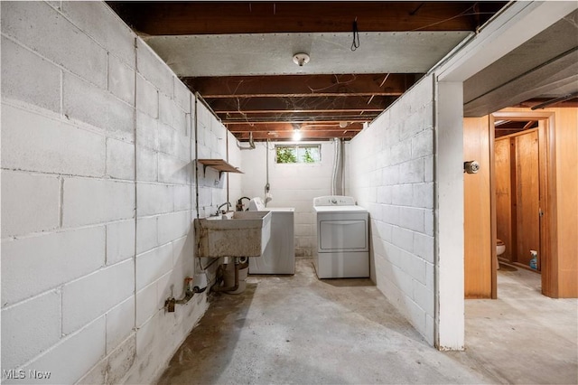 1005 Fairview Blvd, Coshocton, OH 43812 - basement with washer and clothes dryer and a sink
