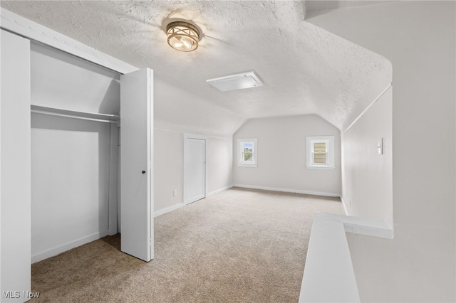 3497 Raymont Blvd, University Heights, OH 44118 - additional living space featuring carpet, vaulted ceiling, and a textured ceiling