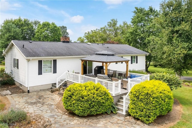 3111 Serfass Rd, New Franklin, OH 44216 - rear view of property featuring a gazebo, a chimney, a deck, and roof with shingles