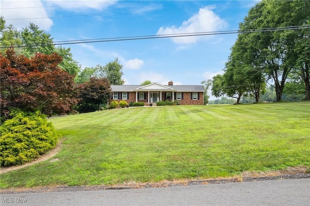 3111 Serfass Rd, New Franklin, OH 44216 - ranch-style house with a front lawn, a chimney, and brick siding