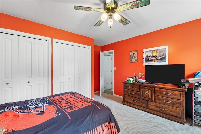 3111 Serfass Rd, New Franklin, OH 44216 - bedroom featuring two closets, carpet floors, and ceiling fan