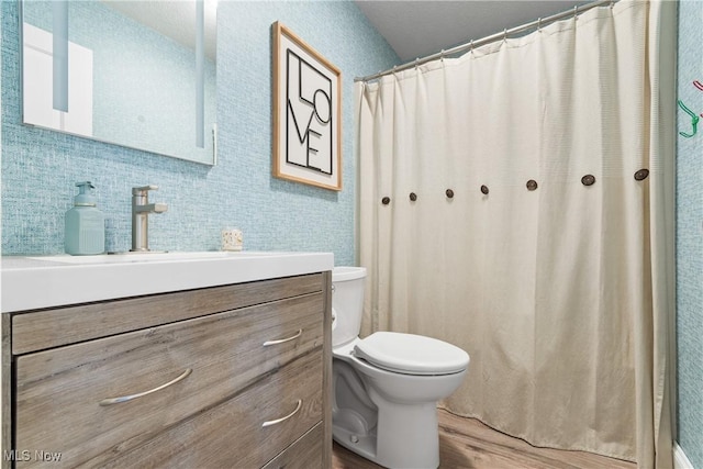 3111 Serfass Rd, New Franklin, OH 44216 - full bathroom featuring wood finished floors, vanity, and curtained shower
