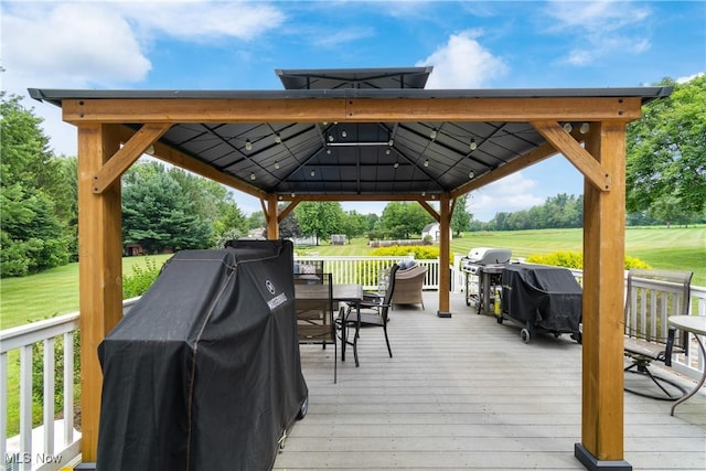 3111 Serfass Rd, New Franklin, OH 44216 - wooden deck with a gazebo, outdoor dining space, and a grill