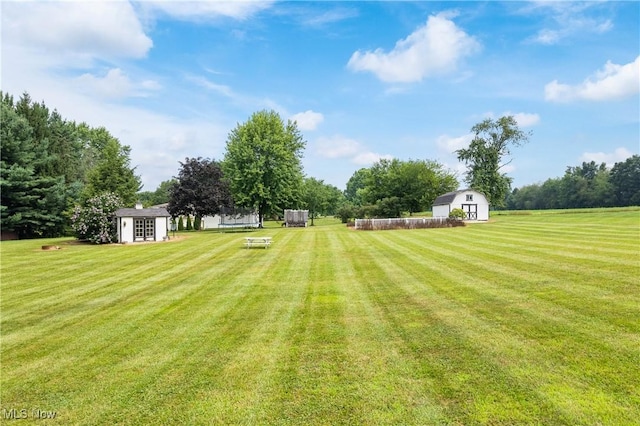 3111 Serfass Rd, New Franklin, OH 44216 - view of grassy yard featuring a shed and a barn