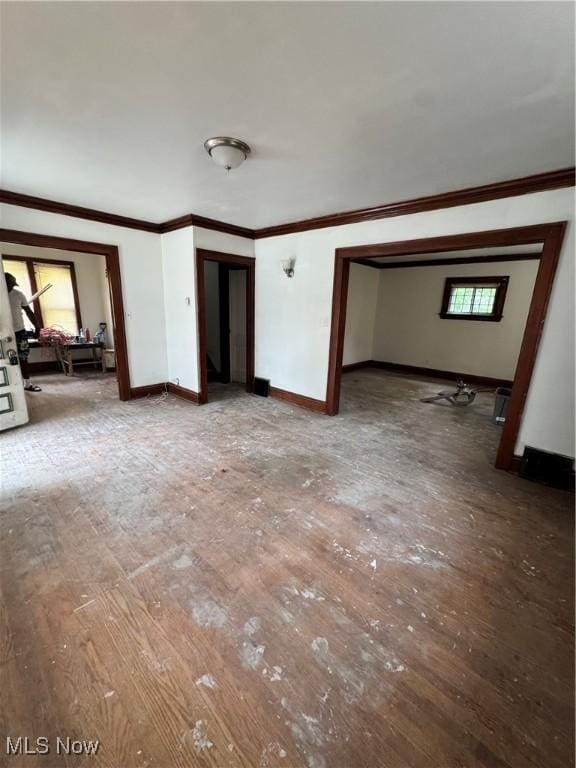 3038 E 130th St, Cleveland, OH 44120 - unfurnished living room featuring crown molding and hardwood / wood-style flooring
