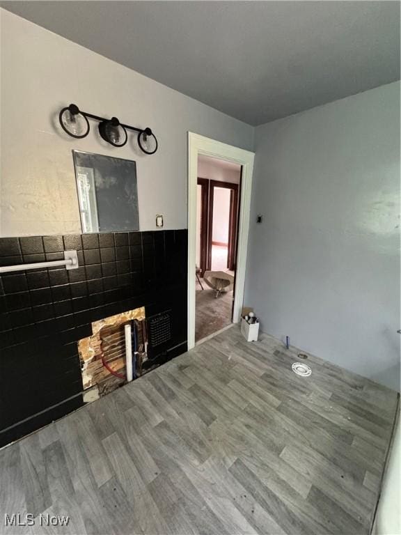 3038 E 130th St, Cleveland, OH 44120 - unfurnished living room with wood finished floors