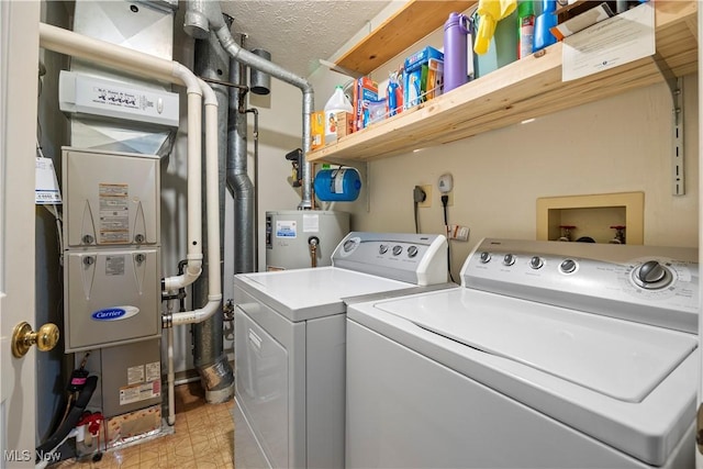 14531 Cross Creek Ln Unit 7, North Royalton, OH 44133 - washroom featuring washing machine and clothes dryer, gas water heater, and light floors