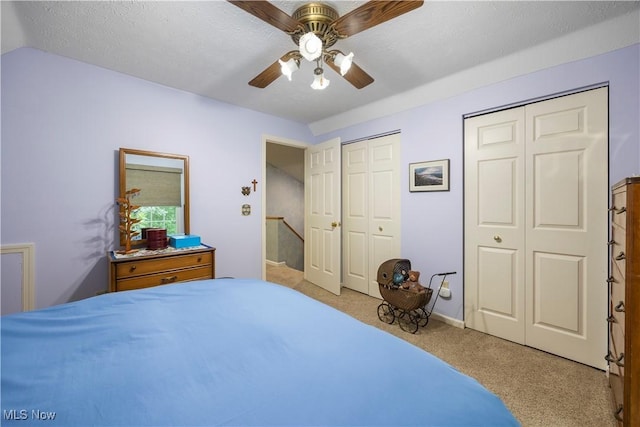 14531 Cross Creek Ln Unit 7, North Royalton, OH 44133 - carpeted bedroom featuring multiple closets and a ceiling fan