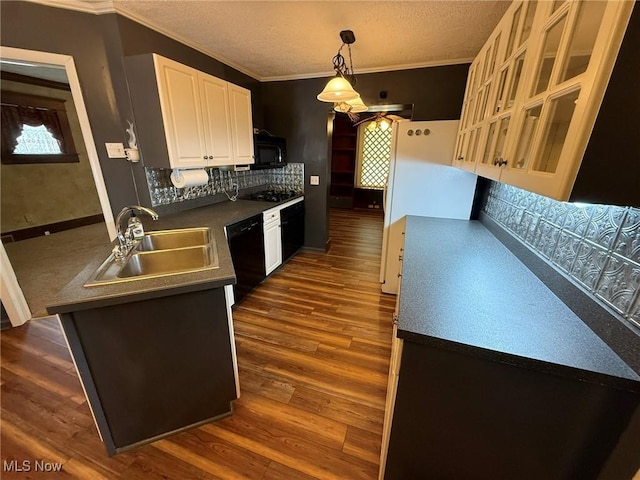 1208 3rd St NW, New Philadelphia, OH 44663 - kitchen featuring black appliances, white cabinets, dark wood-style floors, ornamental molding, and a textured ceiling