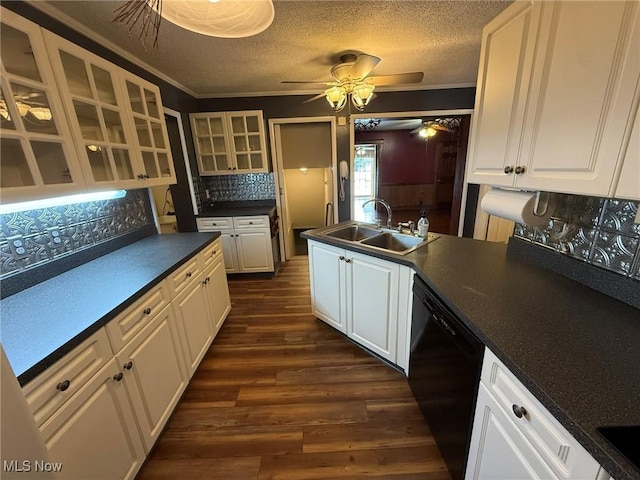 1208 3rd St NW, New Philadelphia, OH 44663 - kitchen with black dishwasher, a ceiling fan, dark countertops, decorative backsplash, and crown molding