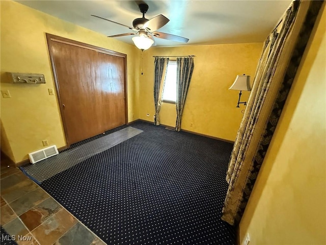 1208 3rd St NW, New Philadelphia, OH 44663 - foyer with a ceiling fan and baseboards