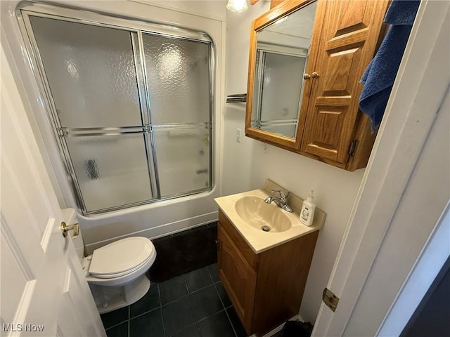 1208 3rd St NW, New Philadelphia, OH 44663 - bathroom with tile patterned flooring, vanity, and enclosed tub / shower combo