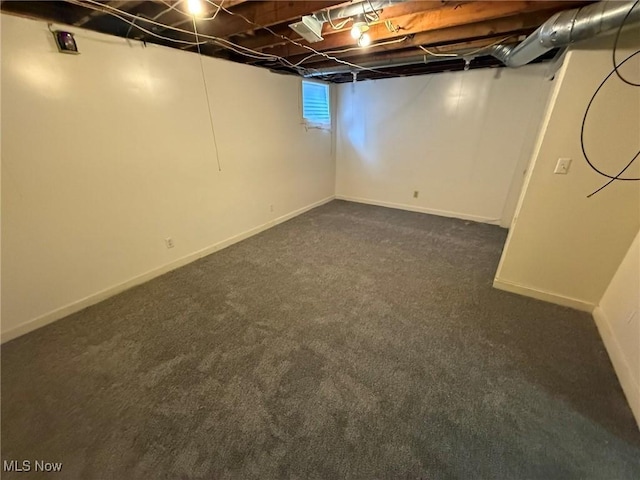 1208 3rd St NW, New Philadelphia, OH 44663 - finished basement featuring dark carpet and baseboards