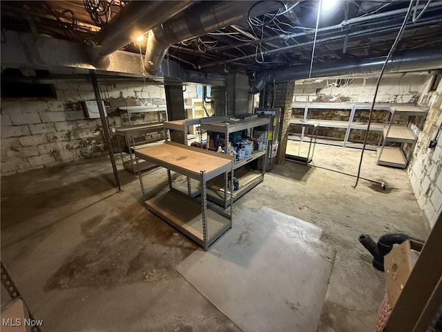 1208 3rd St NW, New Philadelphia, OH 44663 - unfinished below grade area with a workshop area and water heater