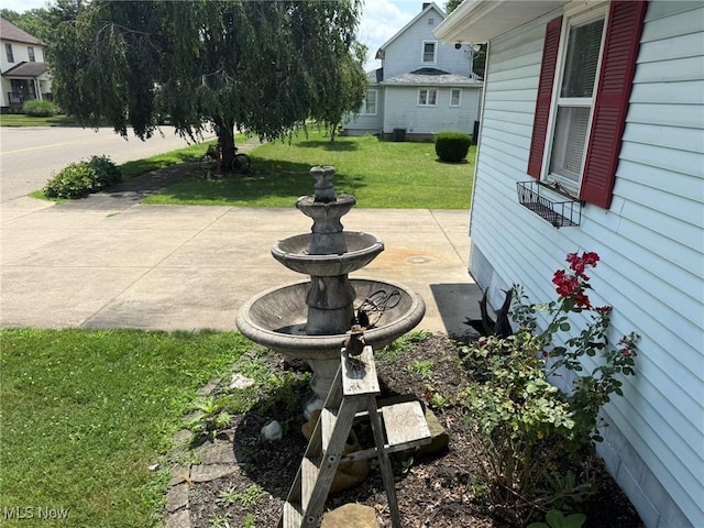 1208 3rd St NW, New Philadelphia, OH 44663 - view of green lawn featuring a patio
