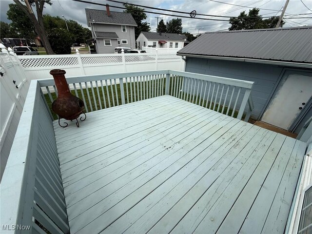 1208 3rd St NW, New Philadelphia, OH 44663 - wooden deck featuring a fenced backyard