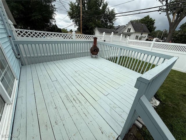 1208 3rd St NW, New Philadelphia, OH 44663 - wooden terrace featuring a fenced backyard