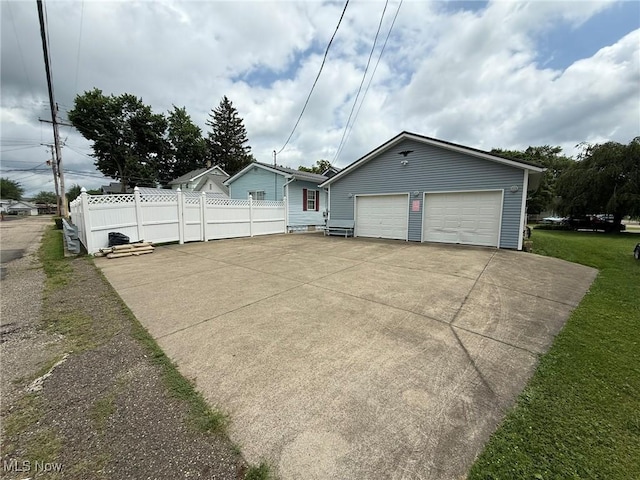 1208 3rd St NW, New Philadelphia, OH 44663 - view of front of house with a garage