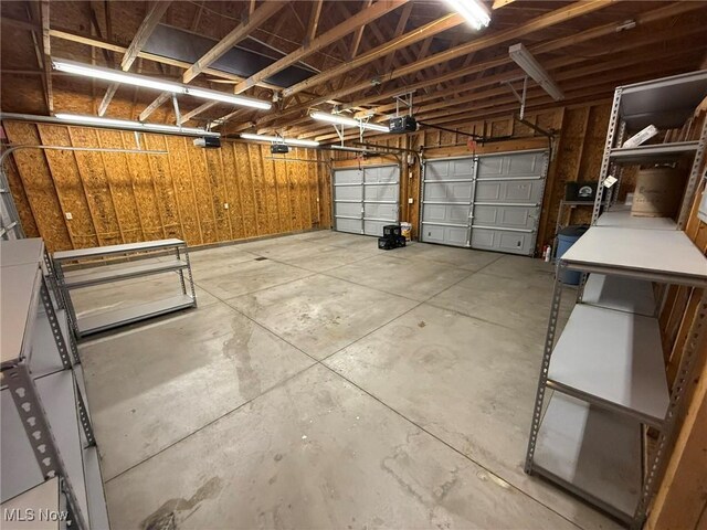 1208 3rd St NW, New Philadelphia, OH 44663 - garage featuring a garage door opener