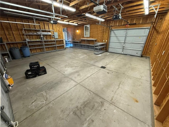 1208 3rd St NW, New Philadelphia, OH 44663 - garage featuring a garage door opener