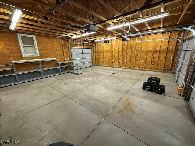 1208 3rd St NW, New Philadelphia, OH 44663 - garage featuring a garage door opener