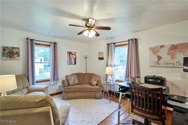 1433 Raleigh Blvd, Copley, OH 44321 - living area with healthy amount of natural light, a ceiling fan, and wood finished floors