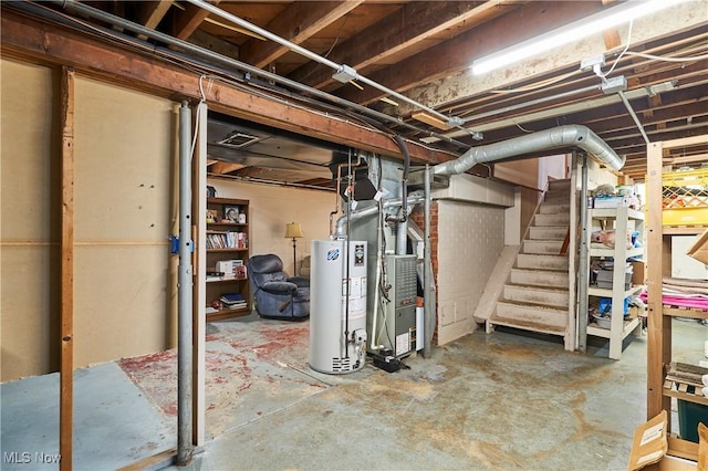 1433 Raleigh Blvd, Copley, OH 44321 - unfinished basement featuring gas water heater, stairs, and heating unit