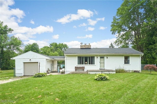 1433 Raleigh Blvd, Copley, OH 44321 - view of front of house with a garage, a front lawn, a chimney, and driveway
