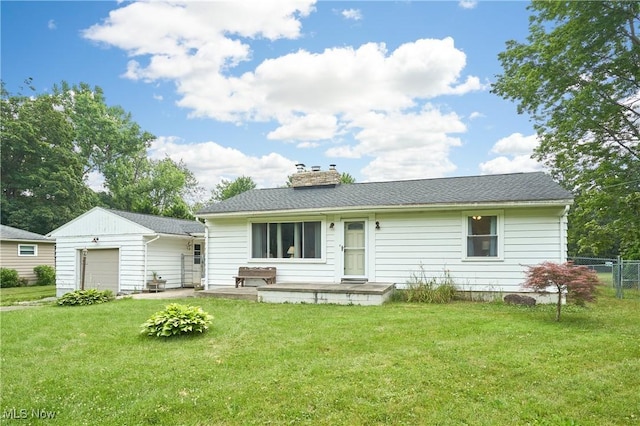 1433 Raleigh Blvd, Copley, OH 44321 - back of house with a garage and a chimney