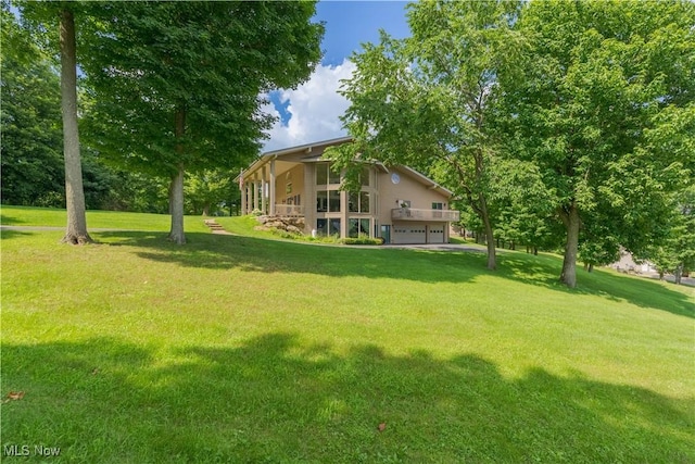 7716 N Ridge Pl, Lisbon, OH 44432 - view of green lawn featuring a garage