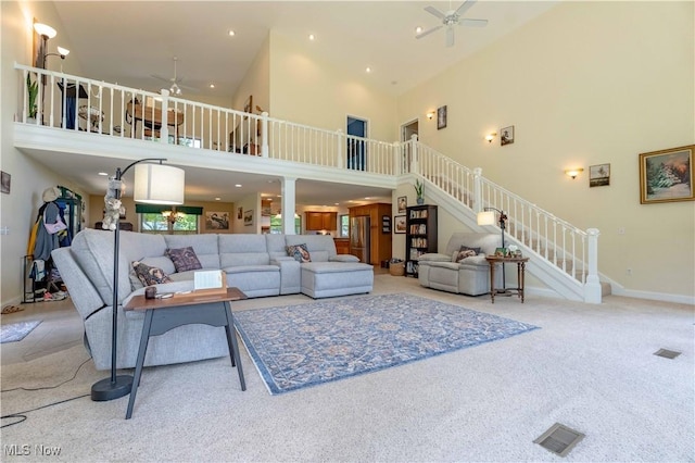 7716 N Ridge Pl, Lisbon, OH 44432 - living room featuring a ceiling fan, a towering ceiling, stairway, carpet flooring, and recessed lighting