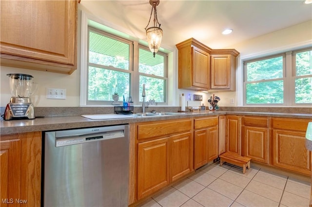 7716 N Ridge Pl, Lisbon, OH 44432 - kitchen with dishwasher, light tile patterned flooring, pendant lighting, and brown cabinetry