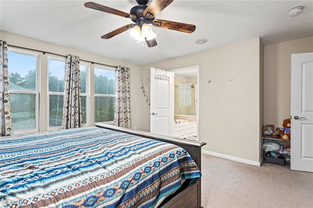 464 Marfa Cir, Copley, OH 44321 - carpeted bedroom featuring a textured ceiling, ensuite bath, and ceiling fan