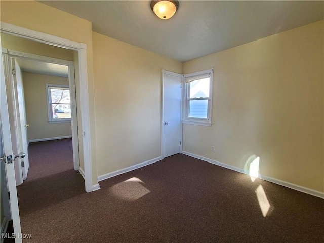 23326 Roger, Euclid, OH 44123 - empty room featuring dark carpet and healthy amount of natural light