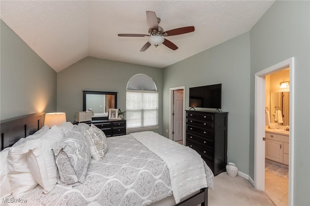 23450 Wainwright Ter, Olmsted Falls, OH 44138 - bedroom featuring lofted ceiling, light colored carpet, ceiling fan, and ensuite bathroom