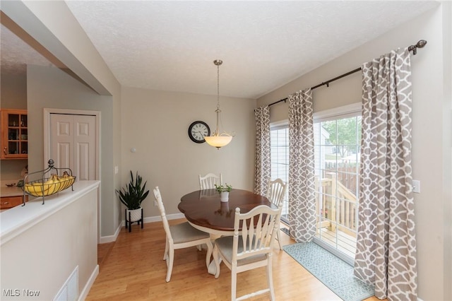 23450 Wainwright Ter, Olmsted Falls, OH 44138 - dining room featuring light wood-type flooring and baseboards