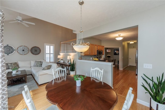 23450 Wainwright Ter, Olmsted Falls, OH 44138 - dining room with light wood finished floors and a ceiling fan
