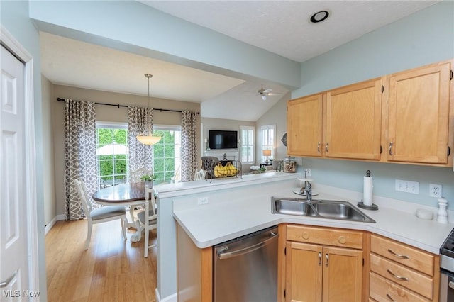 23450 Wainwright Ter, Olmsted Falls, OH 44138 - kitchen with stainless steel dishwasher, a peninsula, vaulted ceiling, light countertops, and light brown cabinetry