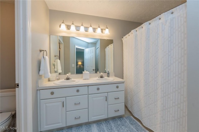 23450 Wainwright Ter, Olmsted Falls, OH 44138 - full bathroom featuring double vanity and curtained shower