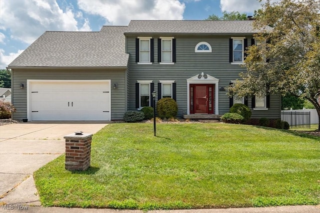 1103 Greenmont Cir, Vienna, WV 26105 - colonial-style house with concrete driveway, an attached garage, and roof with shingles