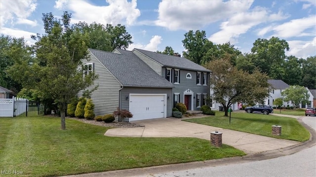 1103 Greenmont Cir, Vienna, WV 26105 - colonial home featuring concrete driveway, an attached garage, and roof with shingles