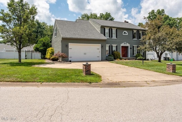 1103 Greenmont Cir, Vienna, WV 26105 - colonial inspired home with a garage, concrete driveway, a chimney, and a shingled roof