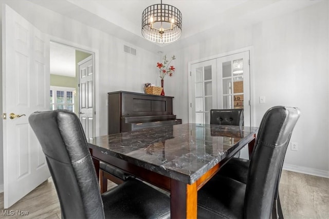 1103 Greenmont Cir, Vienna, WV 26105 - dining space with french doors and light wood finished floors